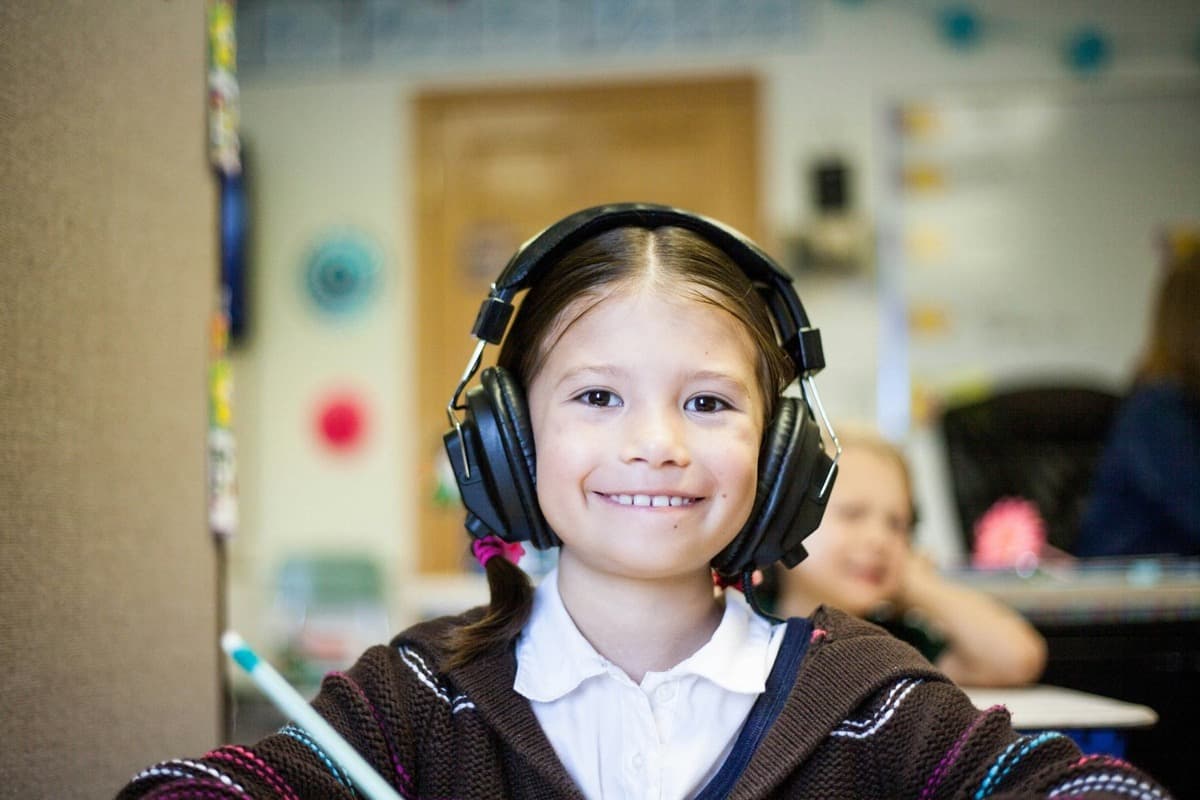 A primary-age student working at a desk during 11+ preparation